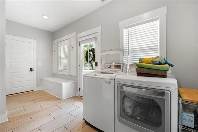 a bedroom with a bed and a dresser with mirror