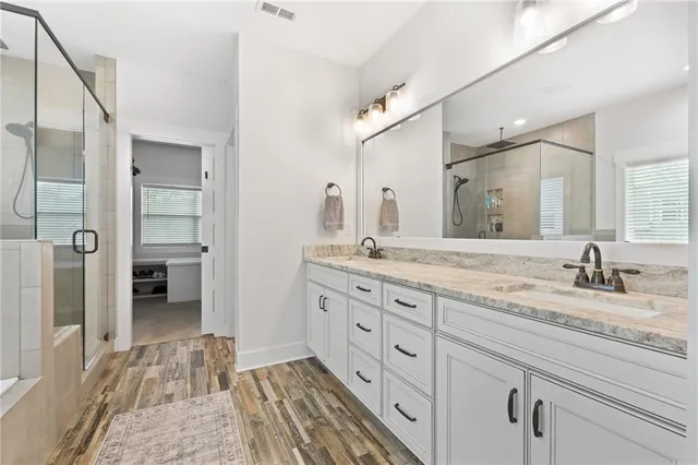 a aerial view of a house with a big yard and potted plants