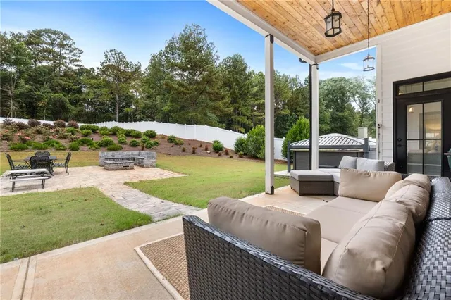 a living room with fireplace furniture and a flat screen tv