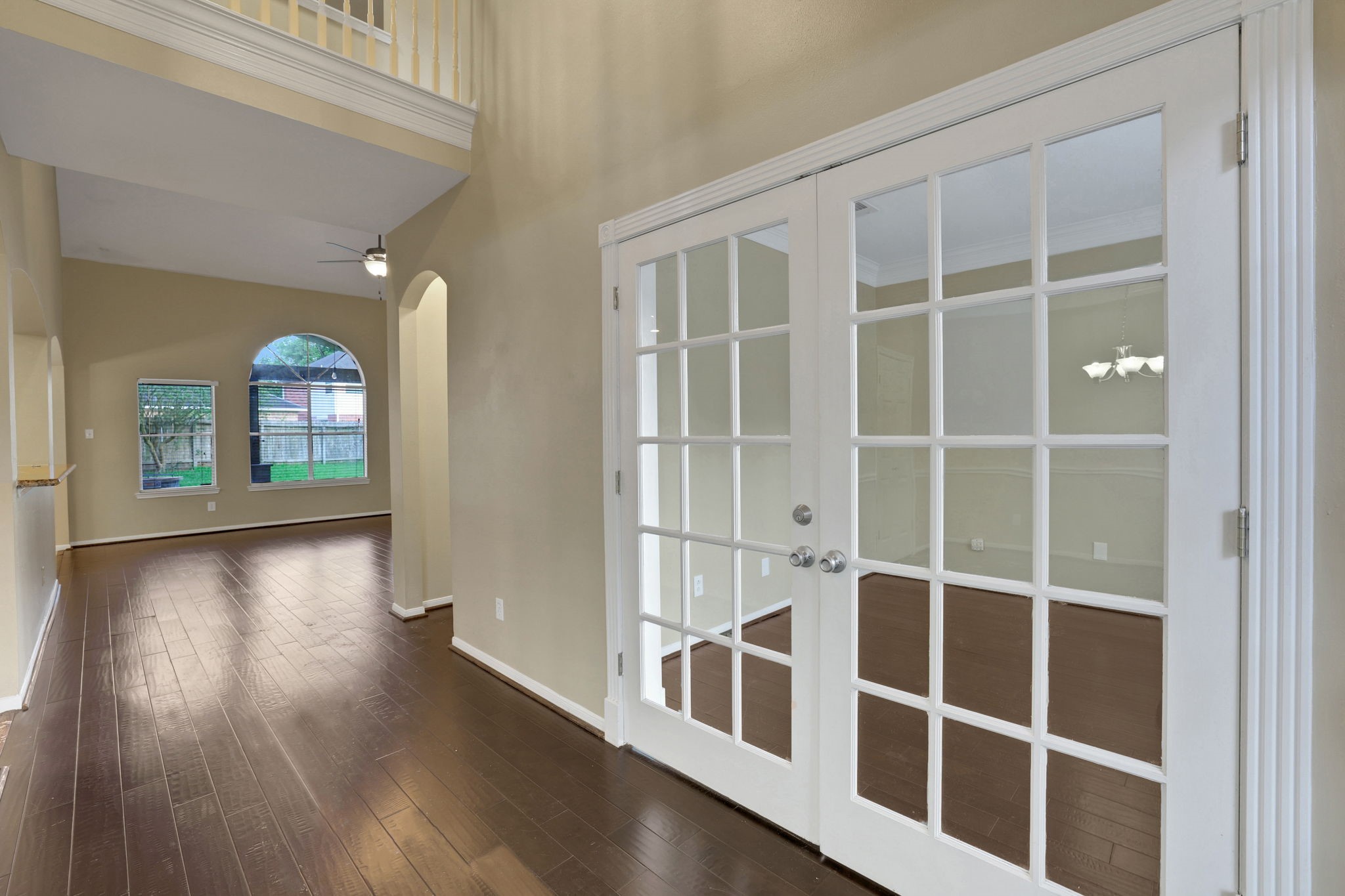 23207 Olive Ridge Court Katy, TX 77494 - Photo 3 of 46 an empty room with wooden floor and windows