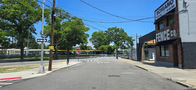 a view of a street with houses on the road