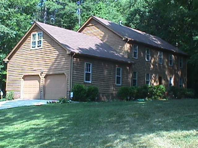 8700 Trailing Cedar Court Raleigh, NC 27613 - Photo 1 of 1 a front view of a house with garden