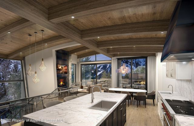a kitchen with stainless steel appliances granite countertop sink stove and cabinets