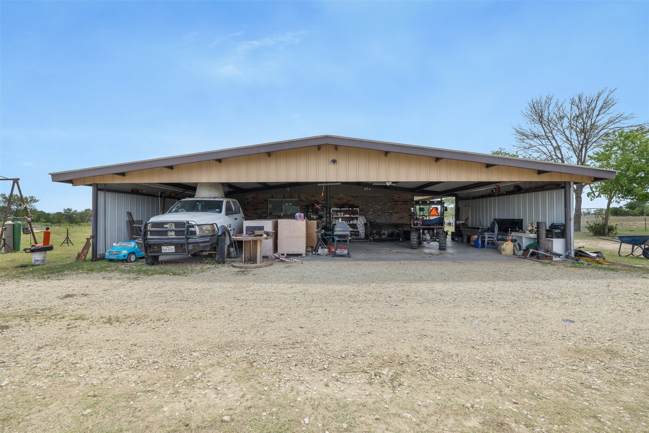 9765 A State Park Road Lockhart, TX 78644 - Photo 22 of 30 View of outdoor structure with a detached carport