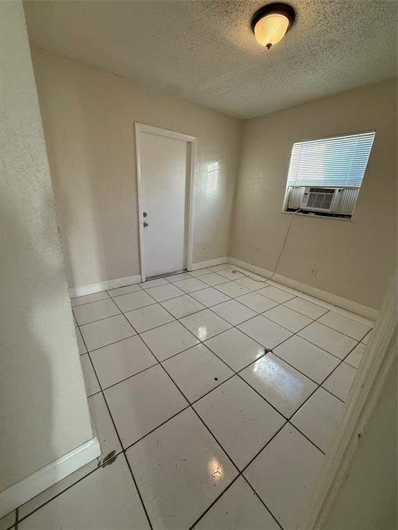 720 Southwest 7th Street, Unit 1 Dania Beach, FL 33004 - Photo 12 of 13 a view of a room with mirror and window
