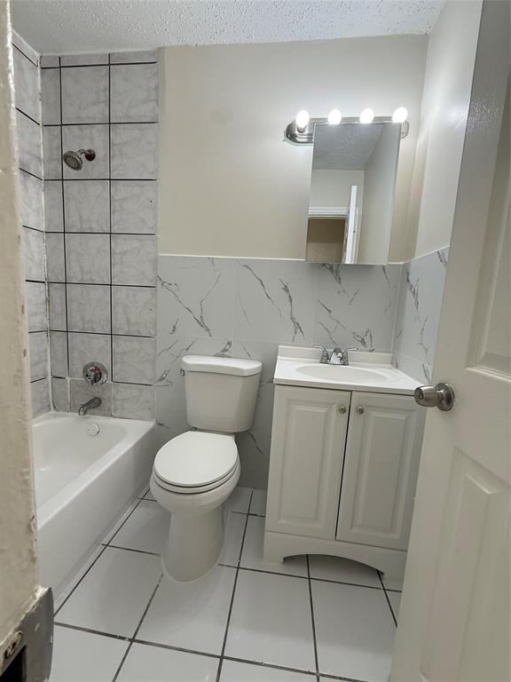 720 Southwest 7th Street, Unit 1 Dania Beach, FL 33004 - Photo 5 of 13 a bathroom with a sink toilet and shower