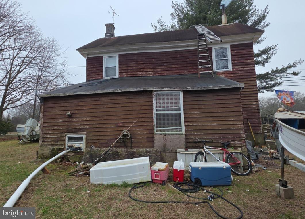 305 Main Street Newport, NJ 08345 - Photo 12 of 26 a backyard of a house with fire pit and outdoor seating