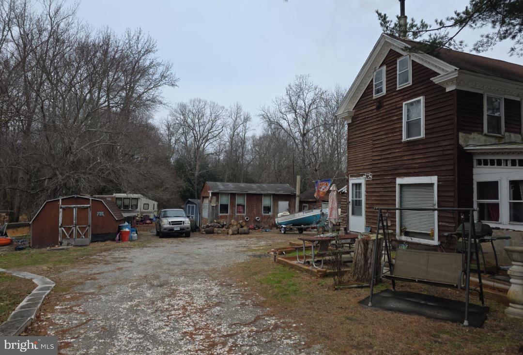 305 Main Street Newport, NJ 08345 - Photo 5 of 26 a view of street with parked cars