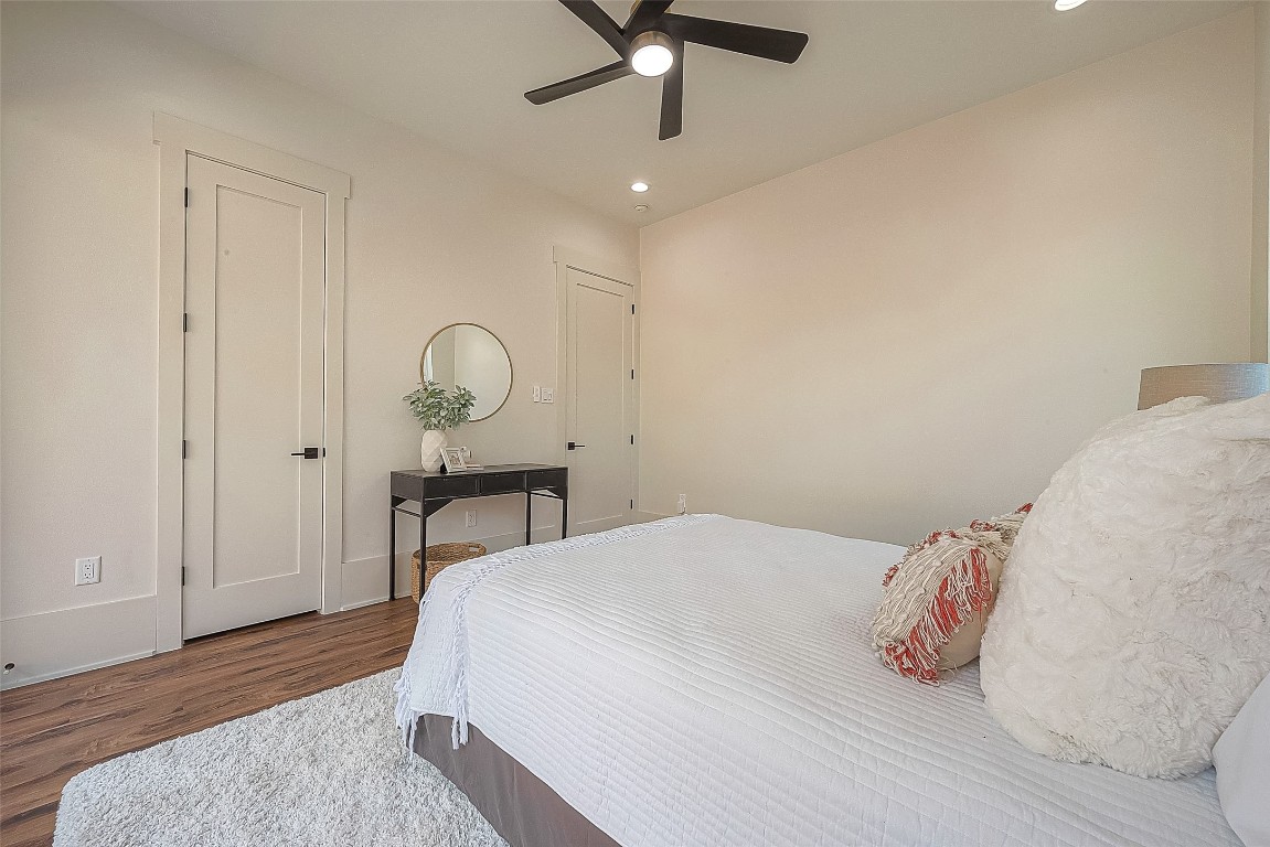 5510 Bosque Street Houston, TX 77056 - Photo 23 of 50 a bedroom with a bed and a chandelier