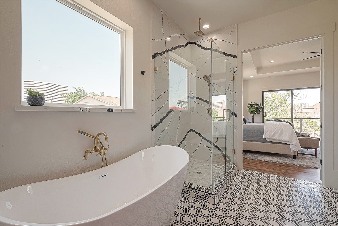 5510 Bosque Street Houston, TX 77056 - Photo 40 of 50 a bathroom with a sink a bathtub and a shower