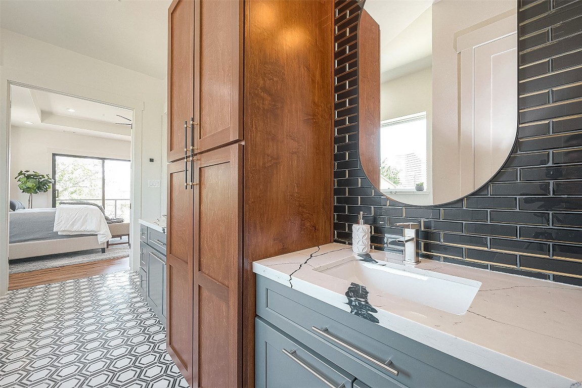 5510 Bosque Street Houston, TX 77056 - Photo 41 of 50 a bathroom with a sink and a mirror
