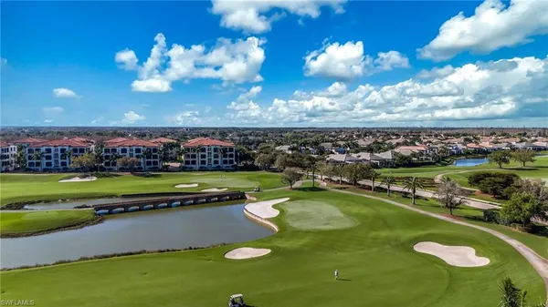 a view of a golf course with a swimming pool