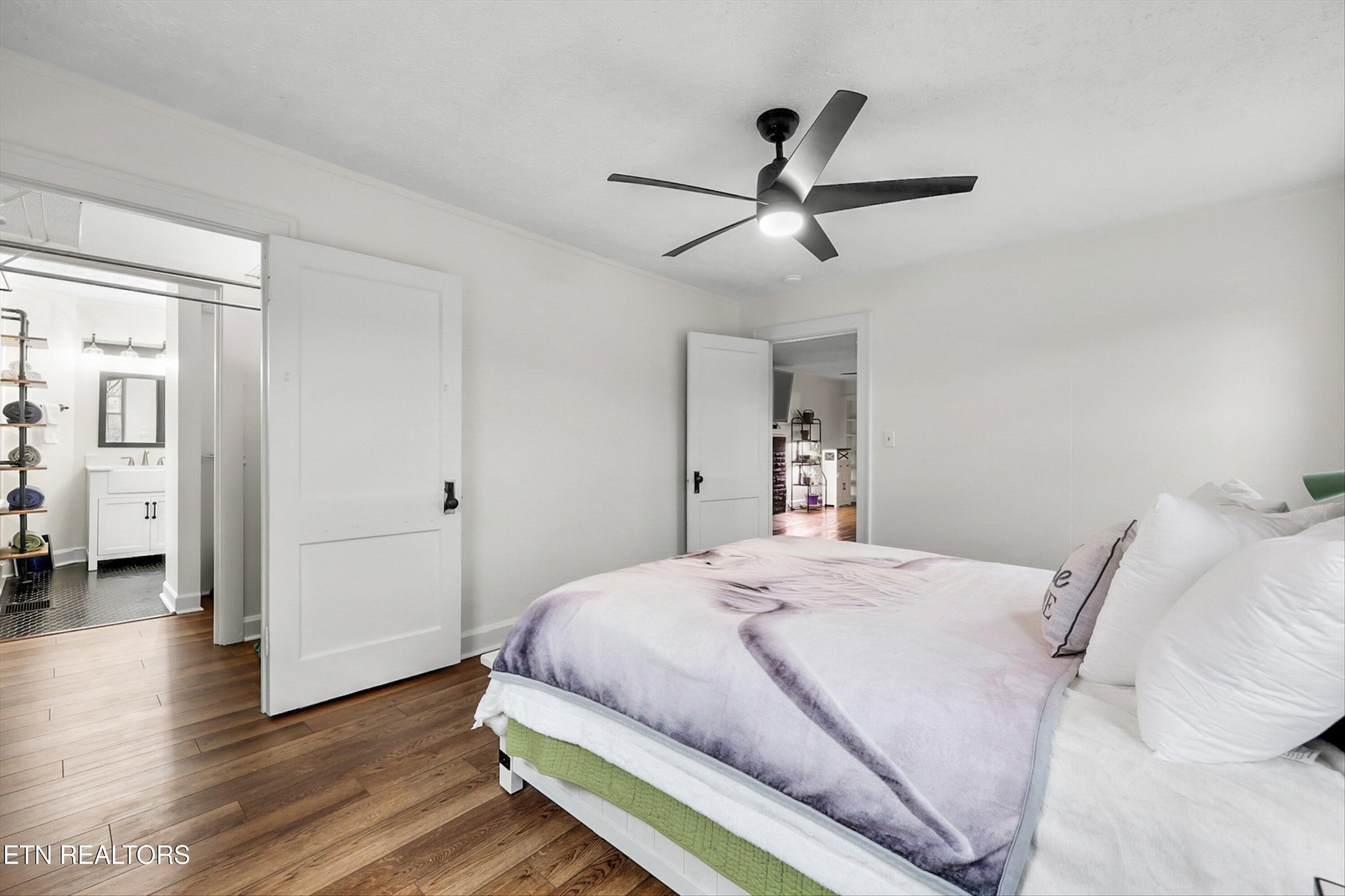 183 Laurel Road Clinton, TN 37716 - Photo 14 of 60 a bedroom with a bed and a large mirror