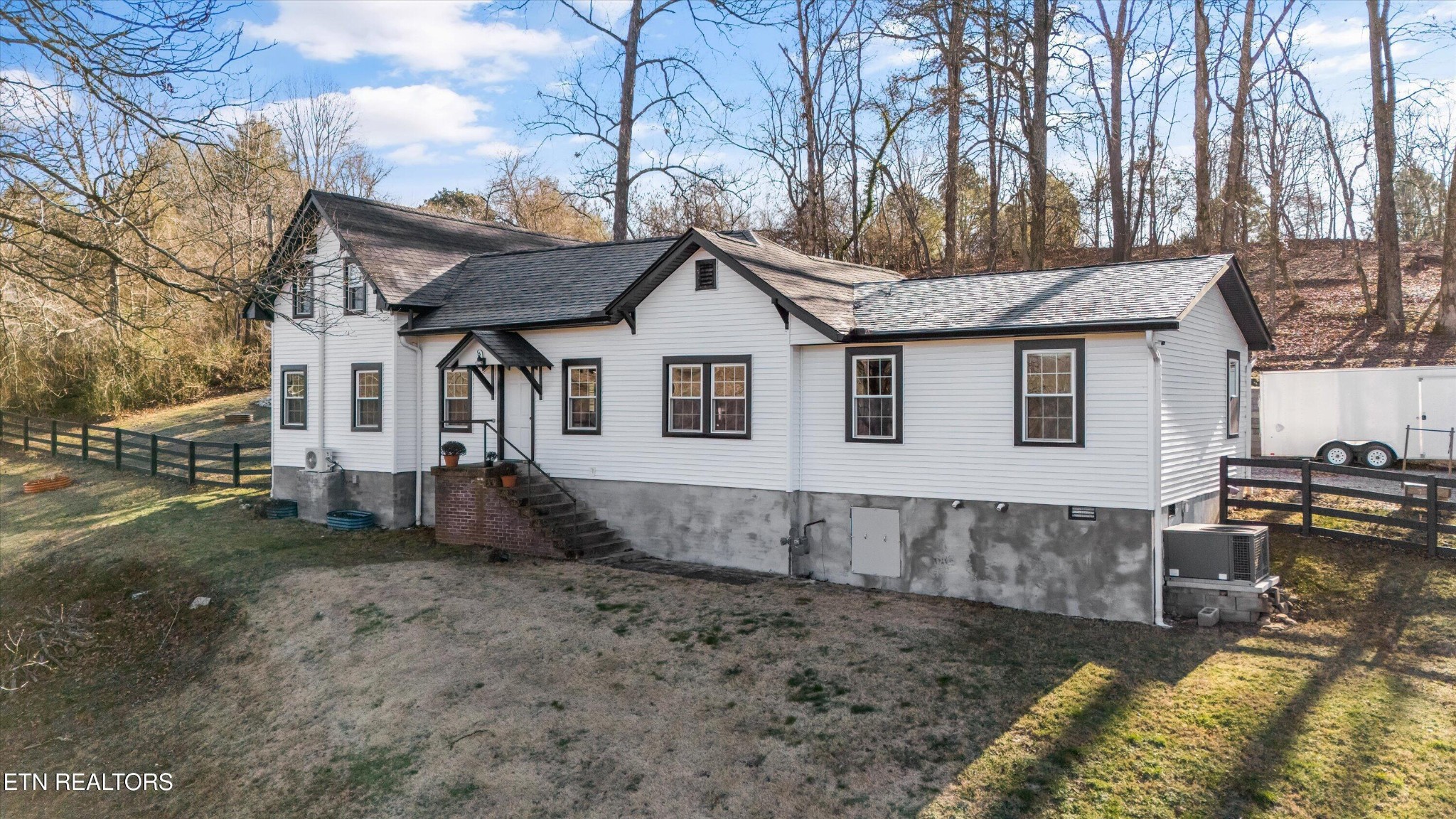 183 Laurel Road Clinton, TN 37716 - Photo 5 of 59 a view of a house with a yard and sitting area