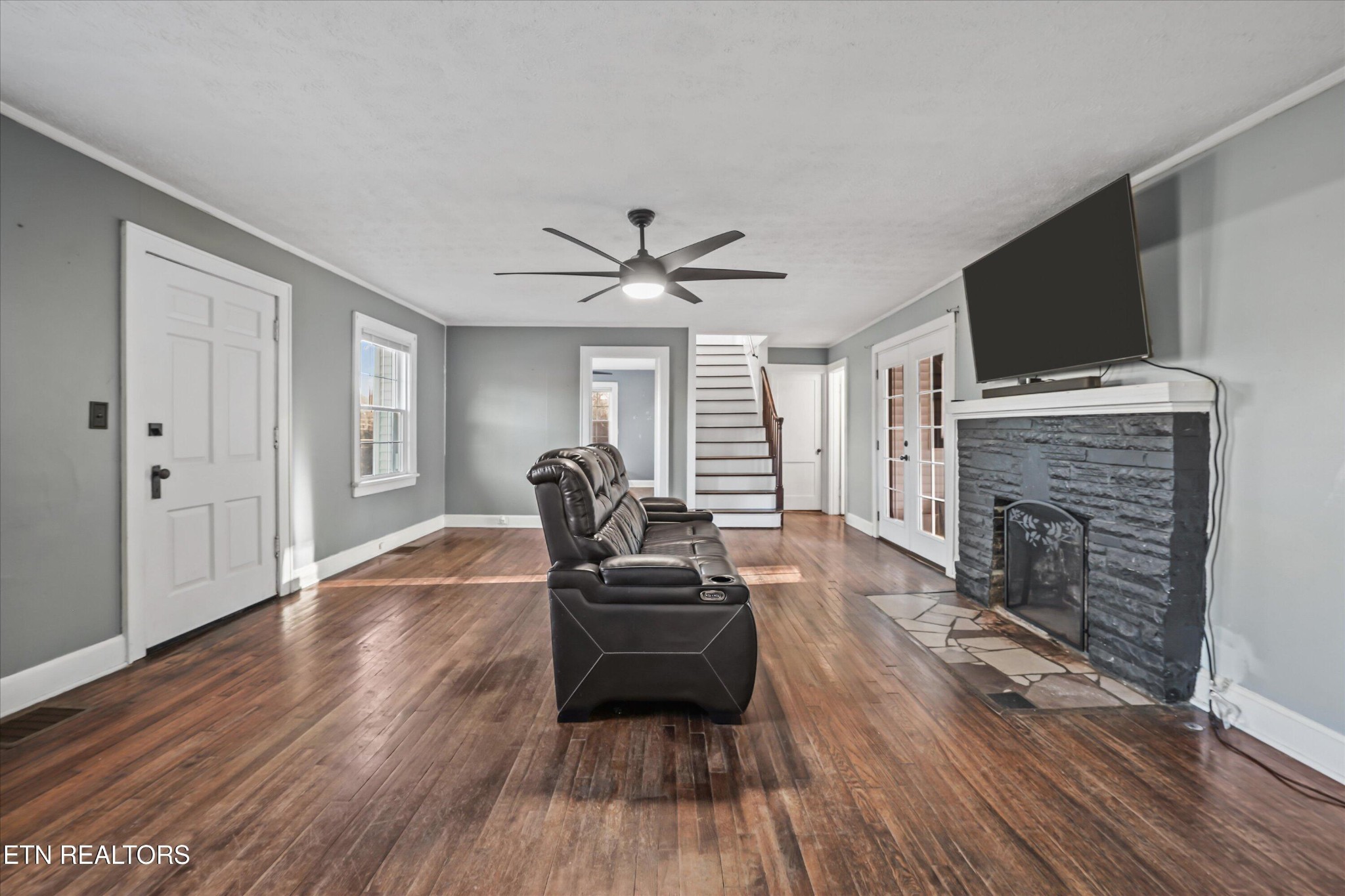 183 Laurel Road Clinton, TN 37716 - Photo 9 of 59 a living room with furniture and a fireplace