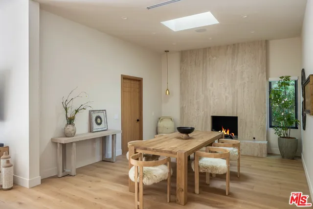 a view of a livingroom with furniture and a fireplace