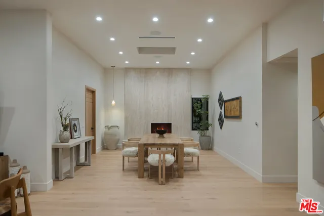 a view of a big room with table and chairs