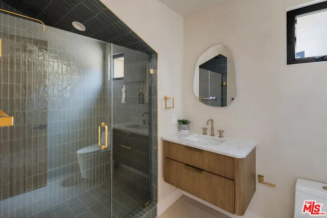 a bathroom with a sink and mirror