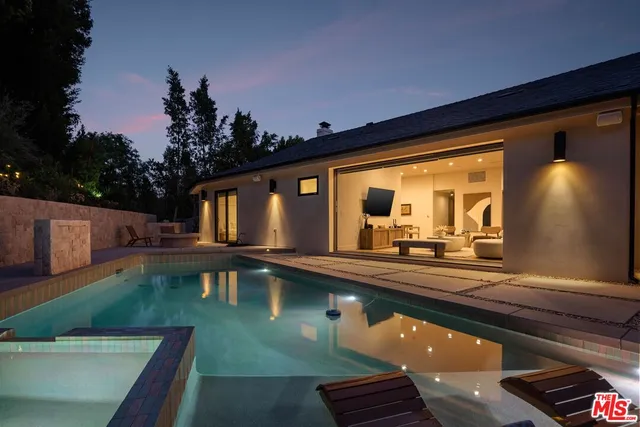 a view of swimming pool with chairs