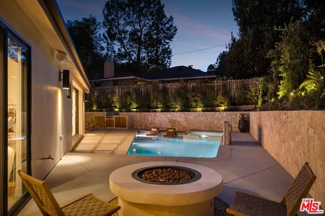 a terrace view with couple of chairs