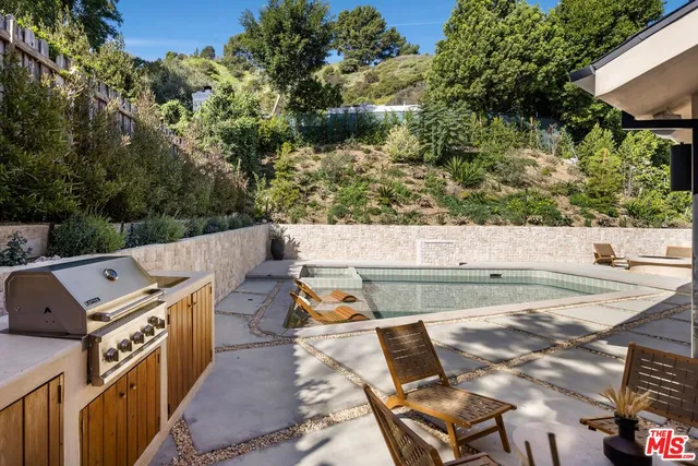 an aerial view of a yard with seating space