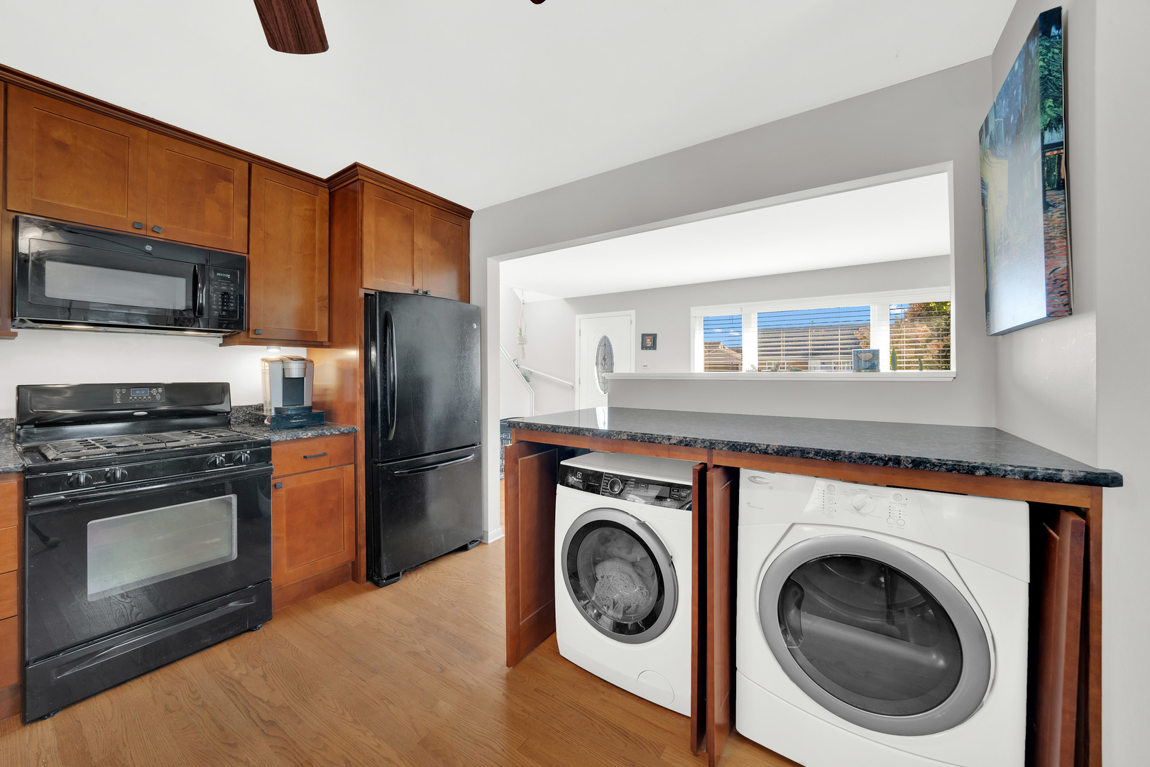 8912 Windsor Lane Bridgeview, IL 60455 - Photo 11 of 25 a kitchen with a washer and dryer