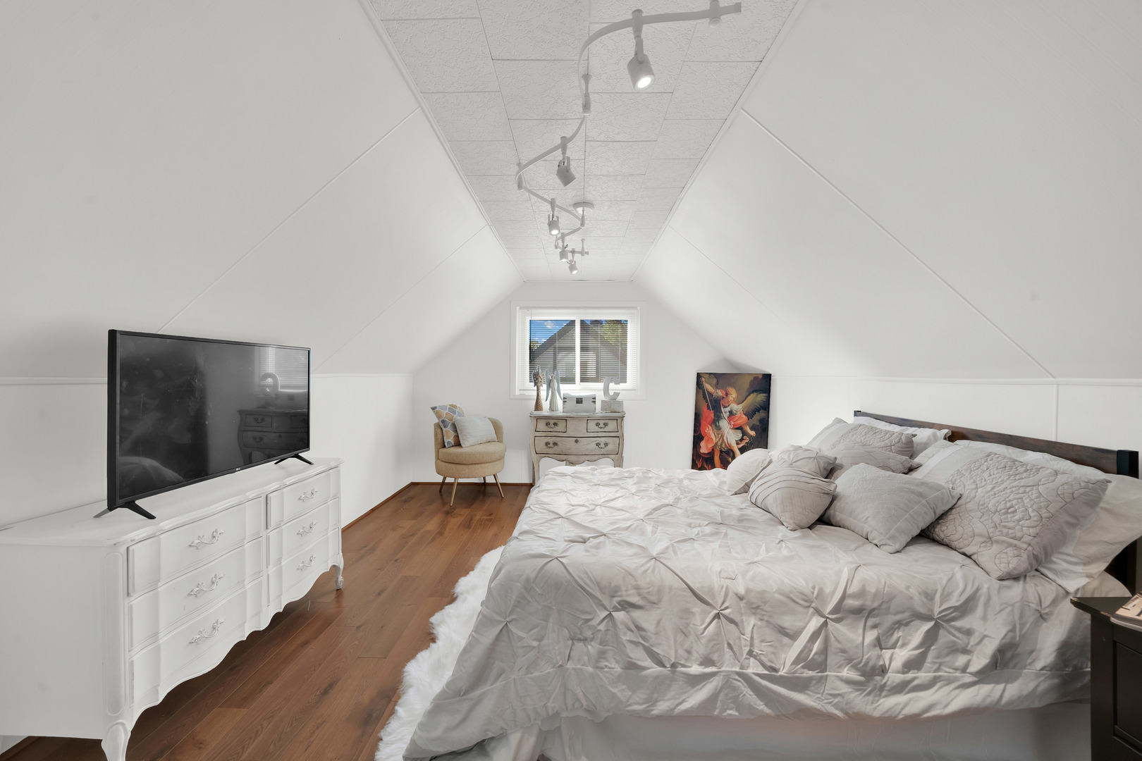 8912 Windsor Lane Bridgeview, IL 60455 - Photo 12 of 25 a bedroom with a bed and a flat screen tv