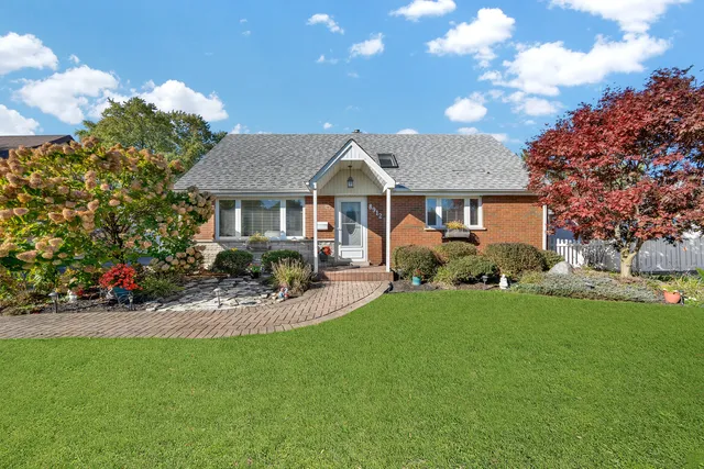 a front view of a house with a garden and porch