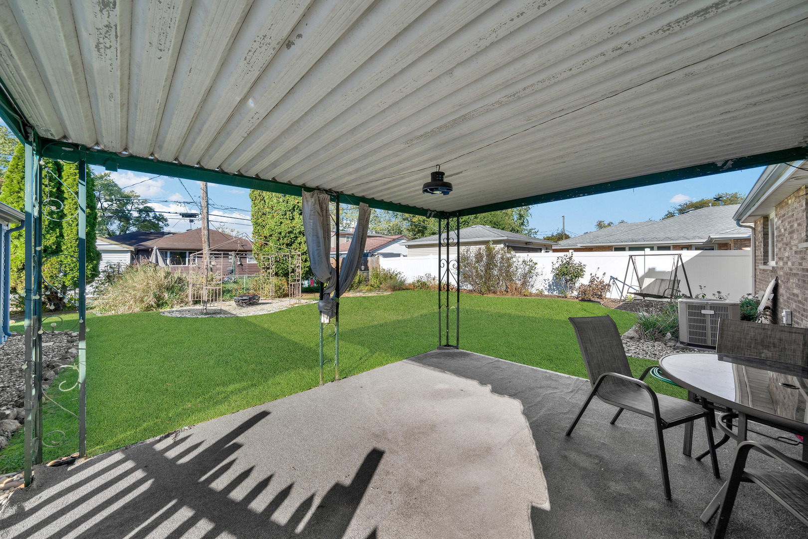 8912 Windsor Lane Bridgeview, IL 60455 - Photo 21 of 25 a view of a porch with furniture and garden