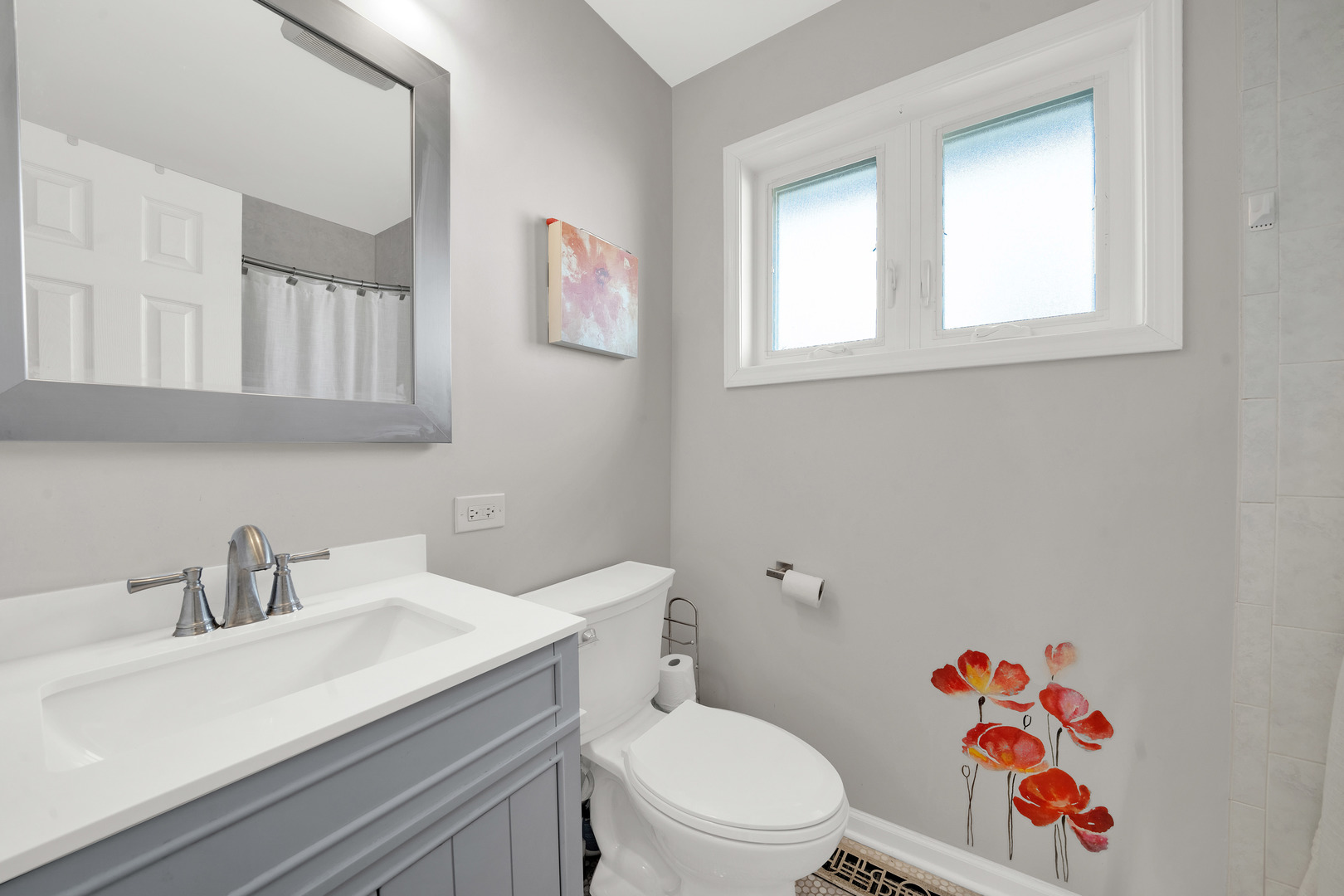 8912 Windsor Lane Bridgeview, IL 60455 - Photo 5 of 25 a bathroom with a sink mirror vanity and toilet