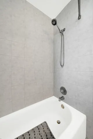 a bathroom with a white bath tub