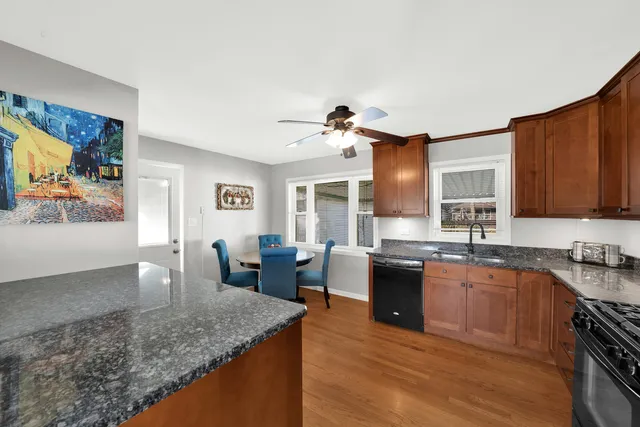 a large kitchen with granite countertop lots of counter top space