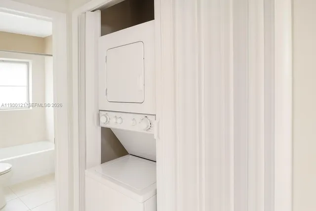 a en suite bathroom with a sink and a shower curtain