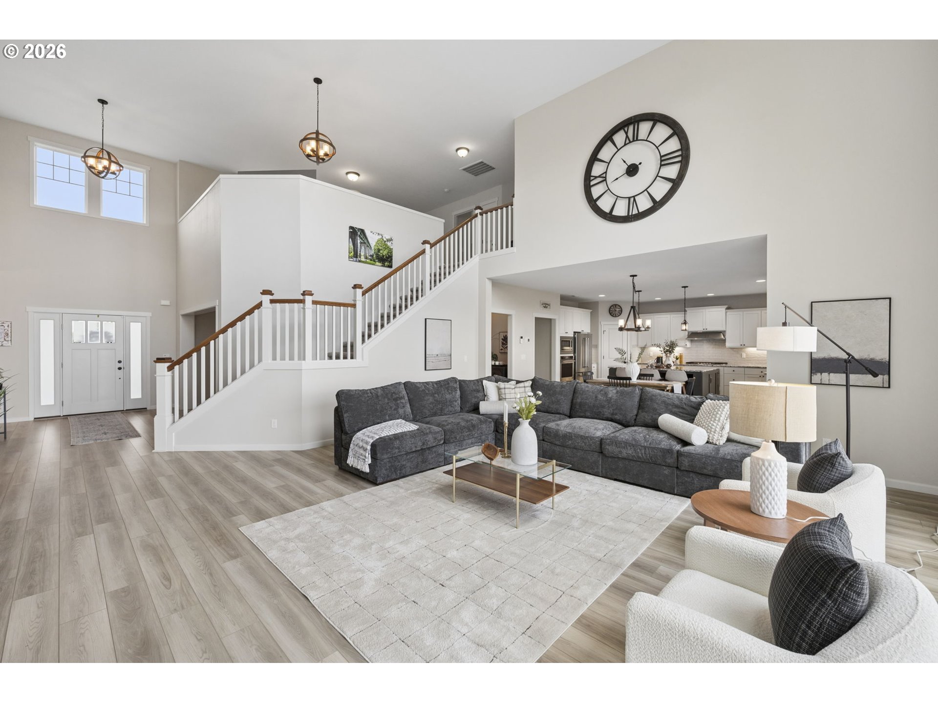 18255 Southeast Vista View Court Sandy, OR 97055 - Photo 11 of 48 a living room with furniture a clock and a view of kitchen