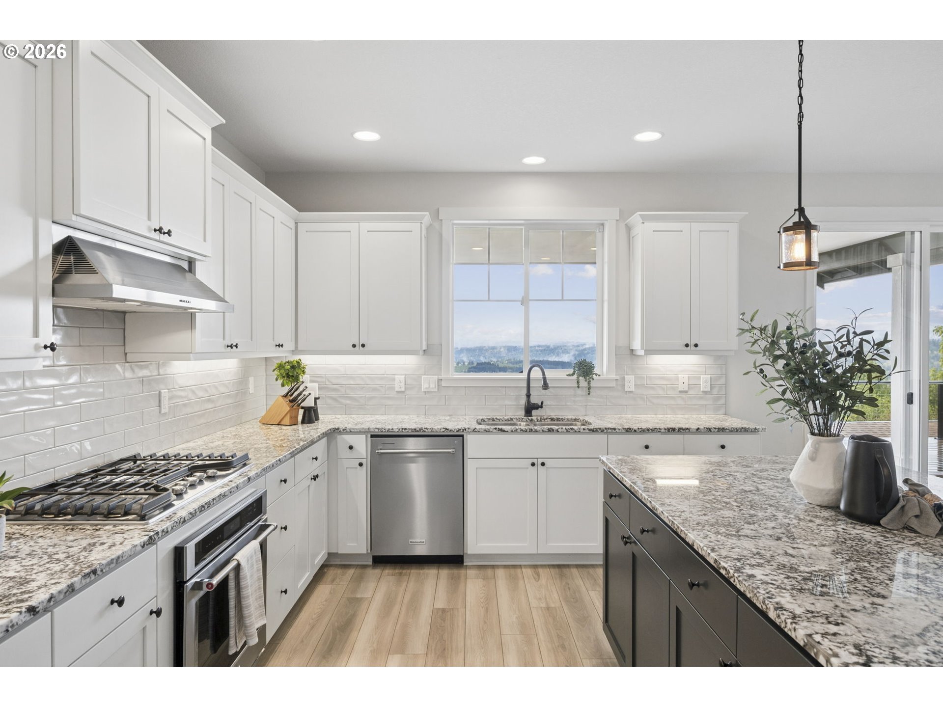 18255 Southeast Vista View Court Sandy, OR 97055 - Photo 15 of 48 a kitchen with a sink stove and cabinets