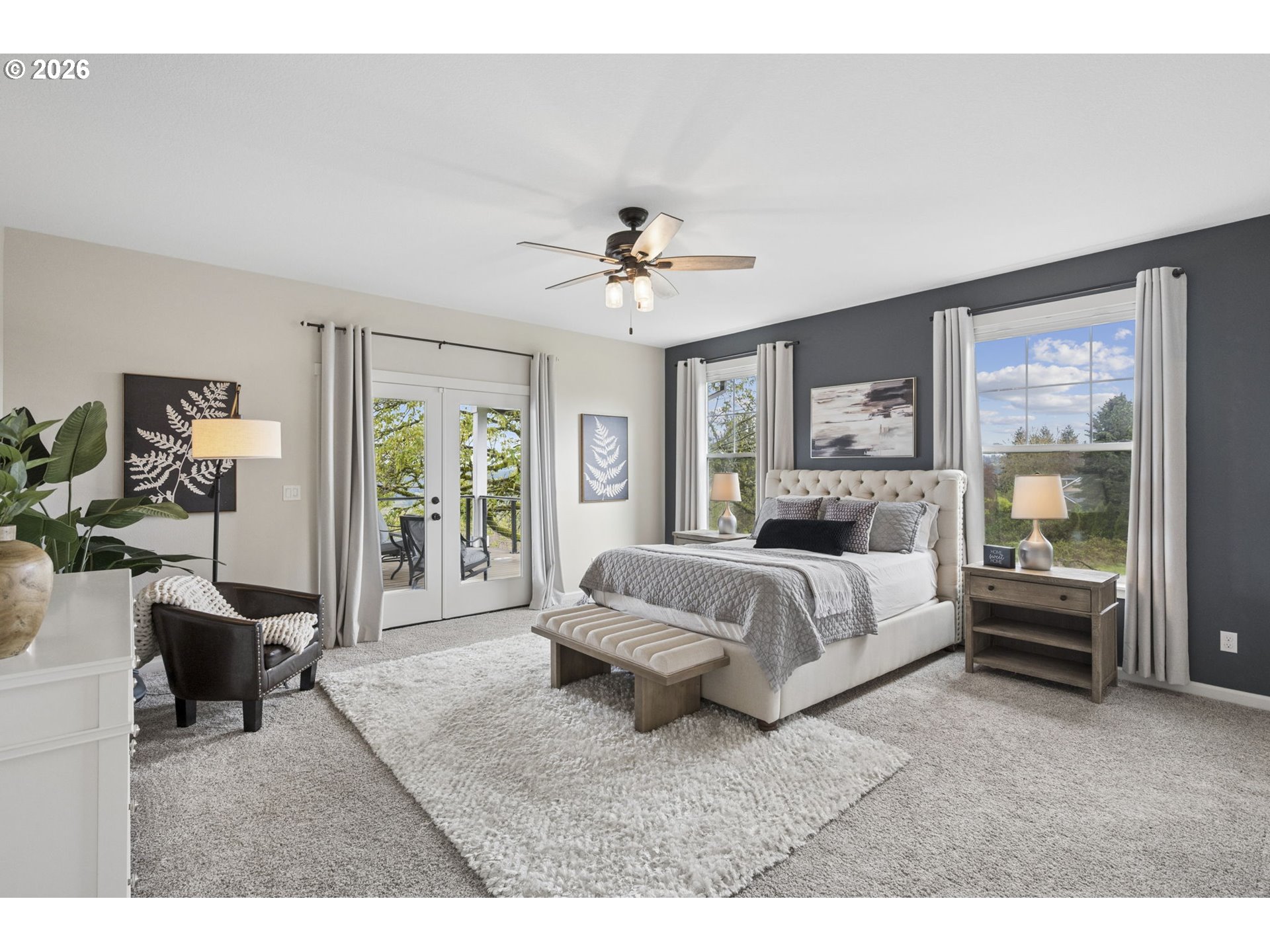 18255 Southeast Vista View Court Sandy, OR 97055 - Photo 19 of 48 a spacious bedroom with a large bed and a chandelier