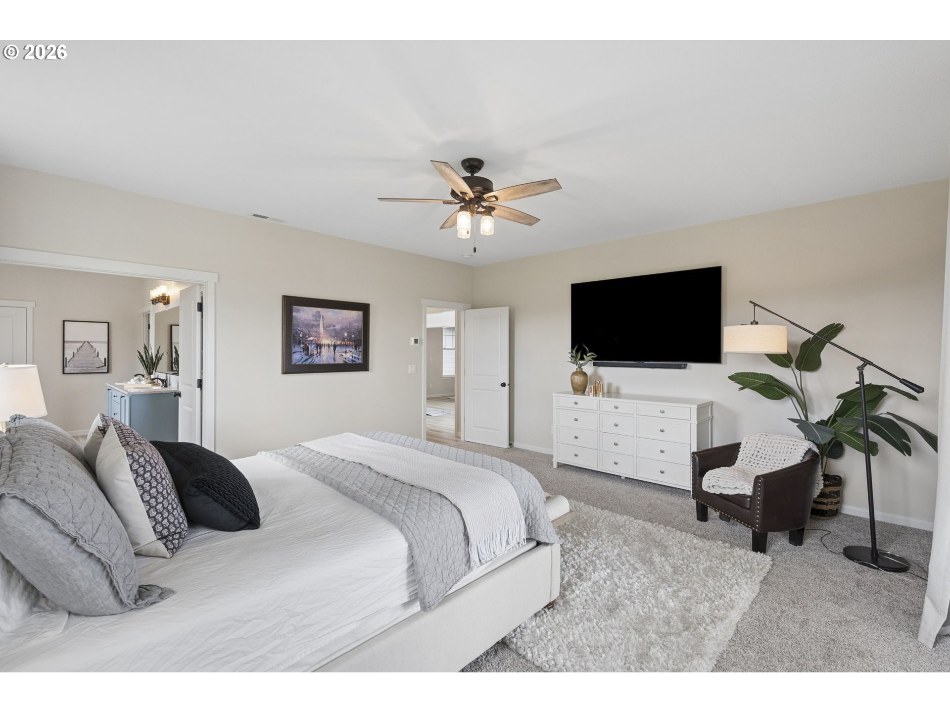 18255 Southeast Vista View Court Sandy, OR 97055 - Photo 21 of 48 a spacious bedroom with a bed and a flat screen tv
