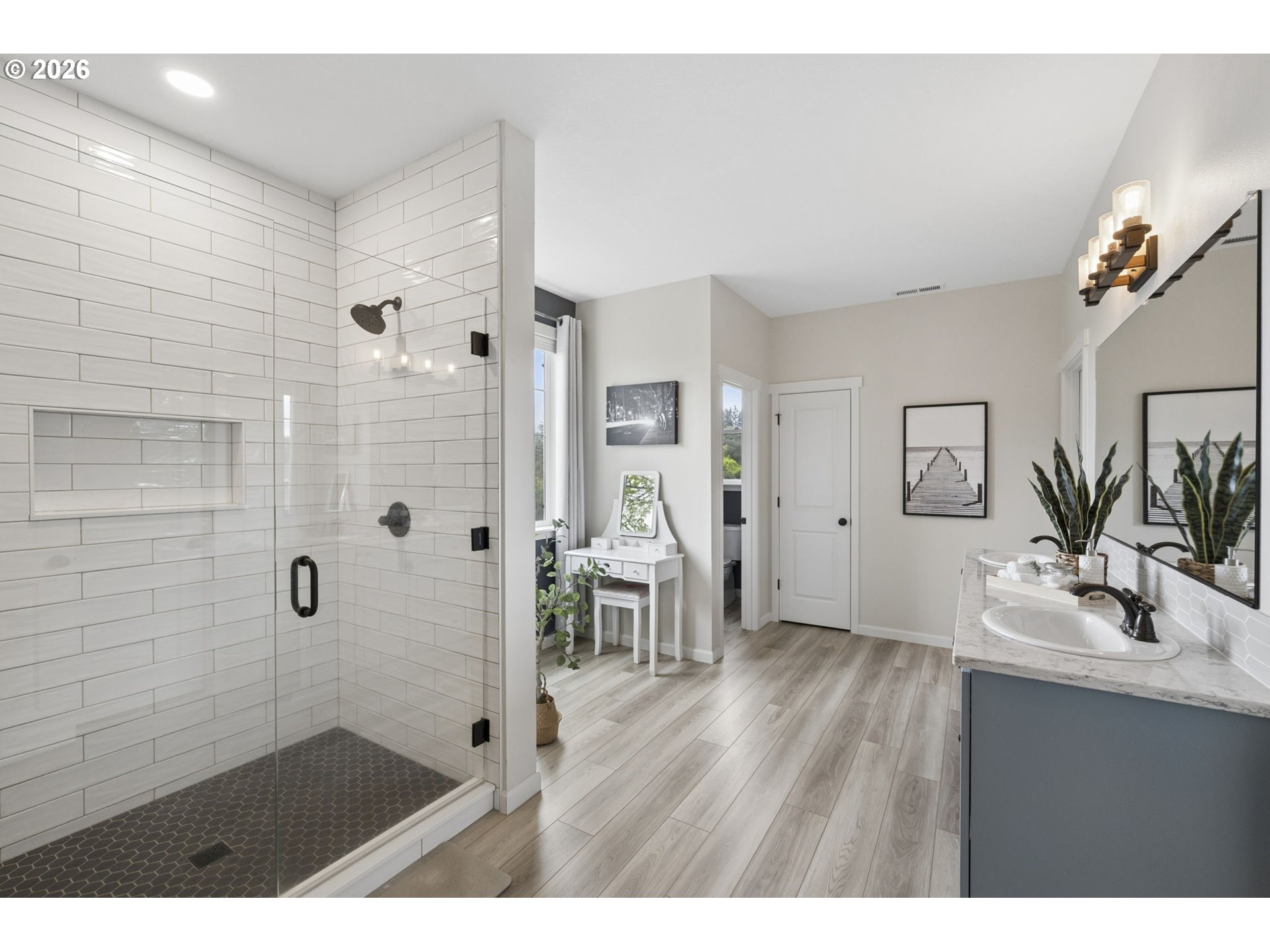 18255 Southeast Vista View Court Sandy, OR 97055 - Photo 22 of 48 a bathroom with a sink a mirror a glass door and shower