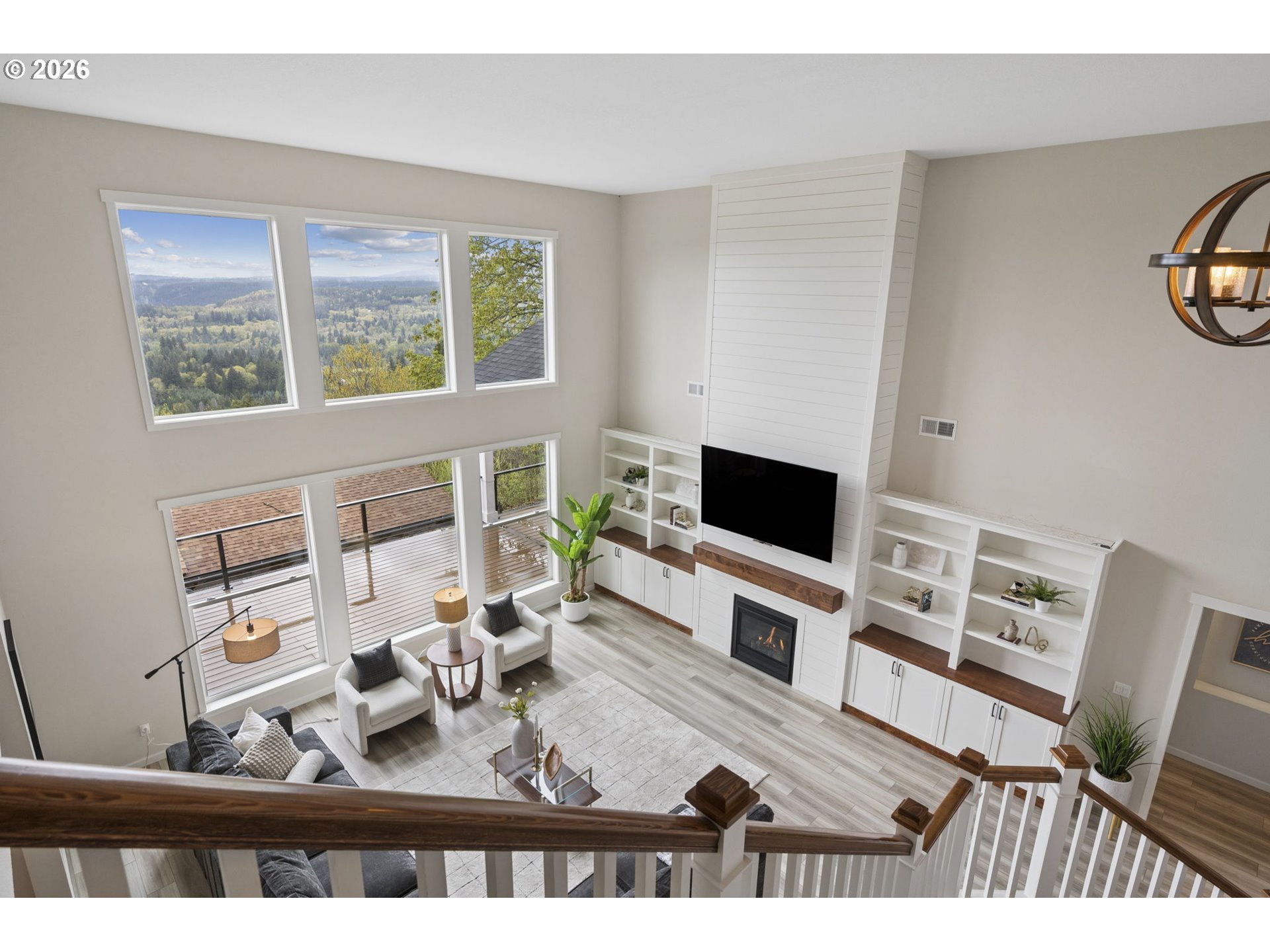 18255 Southeast Vista View Court Sandy, OR 97055 - Photo 24 of 48 a living room with furniture a flat screen tv and a window
