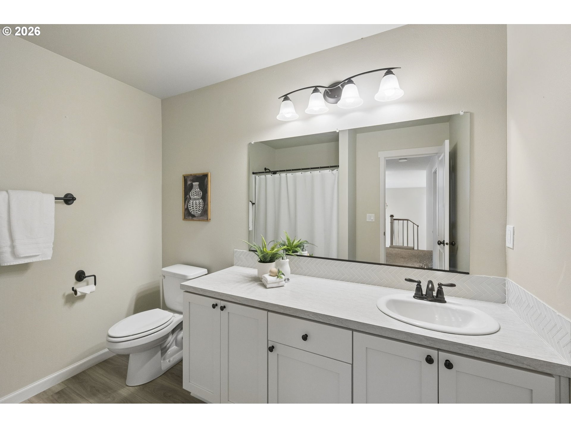 18255 Southeast Vista View Court Sandy, OR 97055 - Photo 30 of 48 a bathroom with a double vanity sink toilet and a mirror