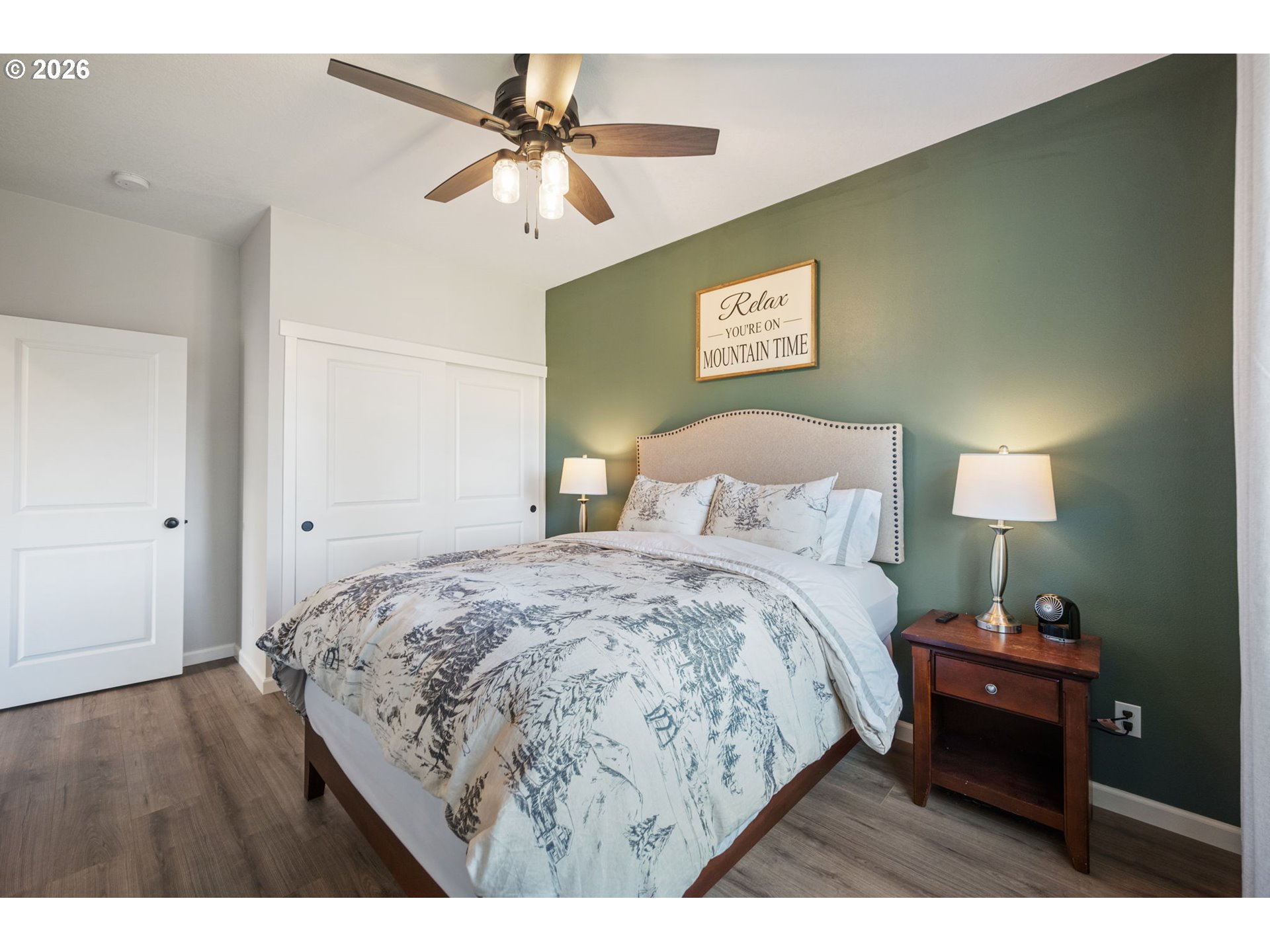 18255 Southeast Vista View Court Sandy, OR 97055 - Photo 40 of 48 a bedroom with a bed and a chandelier