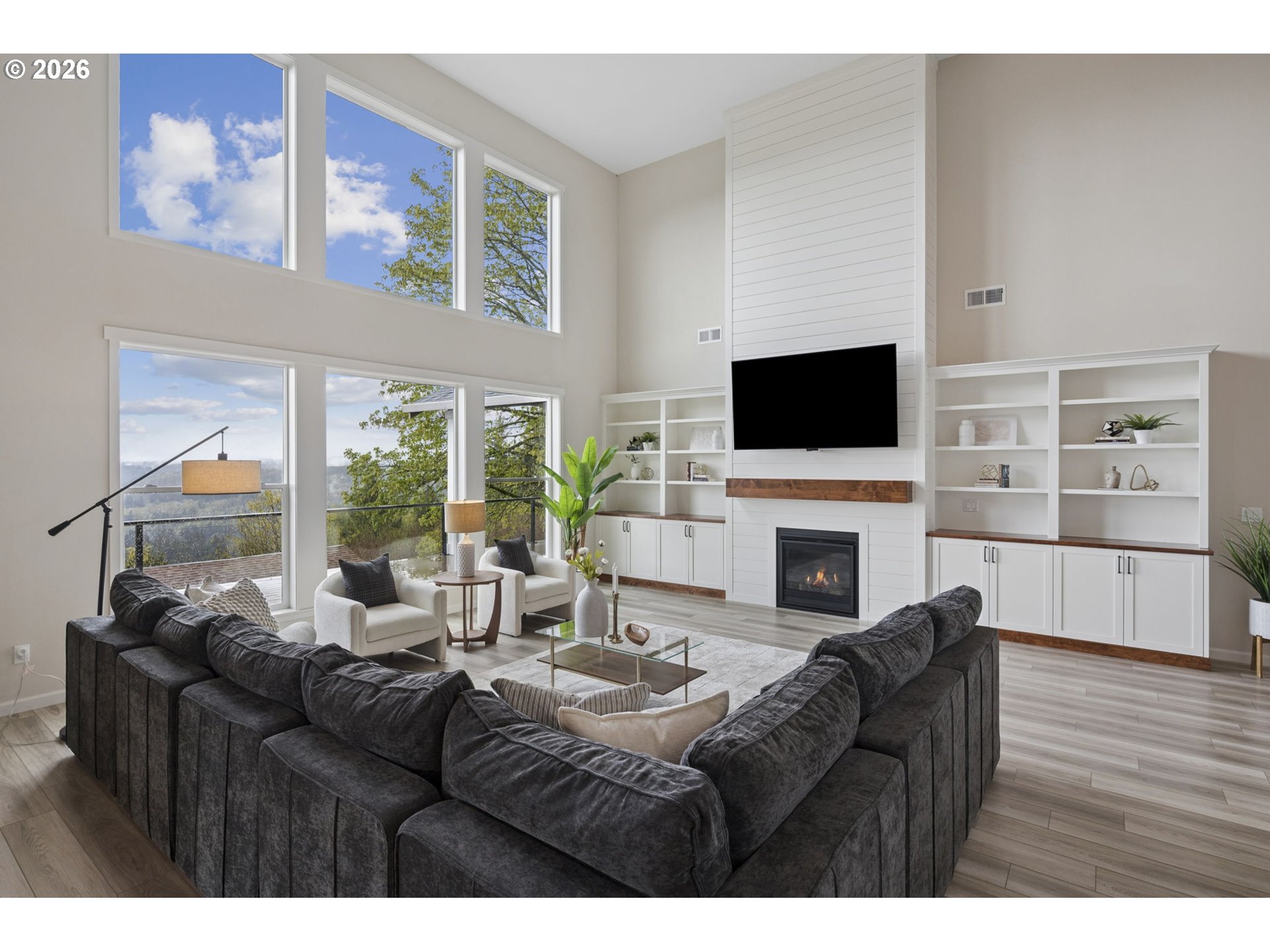 18255 Southeast Vista View Court Sandy, OR 97055 - Photo 10 of 48 a living room with furniture a fireplace and a flat screen tv