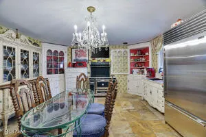 a bathroom with a granite countertop sink a toilet and shower