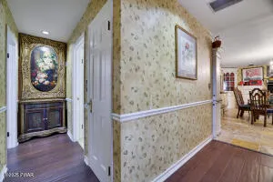 a view of a hallway view with living room and bedroom