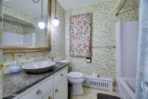 a view of a livingroom with furniture and a flat screen tv