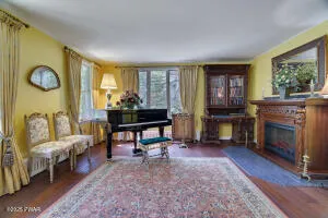 a view of a hallway view with wooden floor and staircase