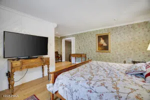 a living room with furniture and flowers