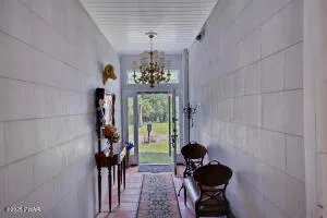 a outdoor space with patio the couches and a dining table with the view of the balcony