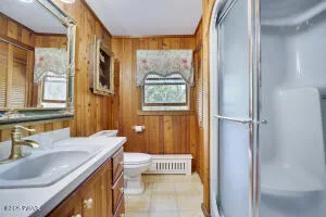 a dining room with furniture water view and a large window