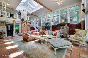 a living room filled with furniture and a fireplace